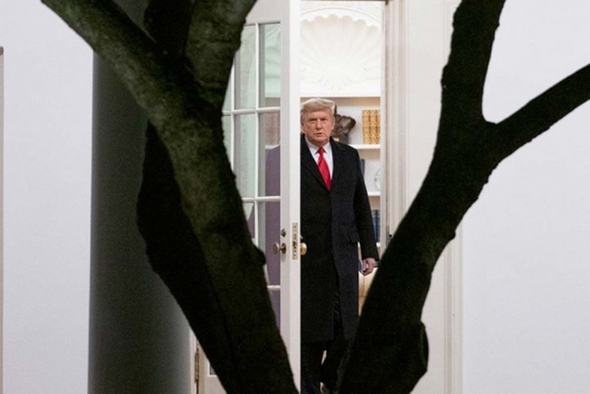 US President Donald Trump walks out of the Oval Office to board Marine One on the South Lawn of the White House in Washington, for a short trip to Andrews Air Force Base, Md., and then on to Dalton, Ga. for a rally. AP/PTI
