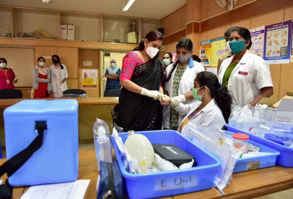 Bengaluru: A medic conducts the dry run of COVID-19 vaccine on a beneficiary, at a civil hospital in Bengaluru, Friday, Jan. 8, 2021. (PTI Photo/Shailendra Bhojak)