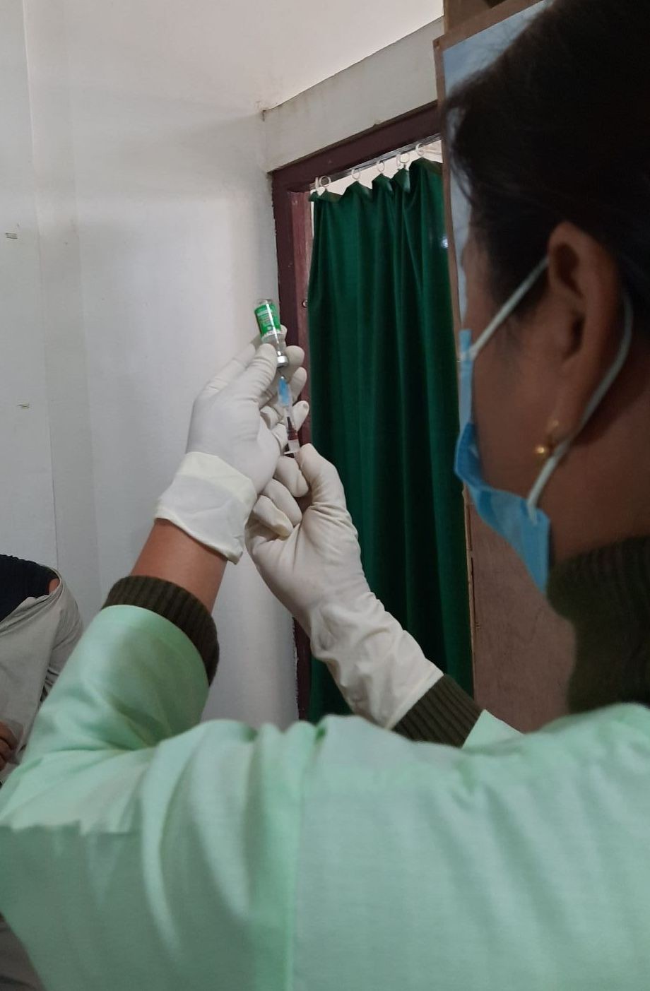 A nurse at Mokokchung’s Imkongliba Memorial District Hospital is seen preparing the first dose of ‘Covidshield’ vaccine for inoculation during the launching of the nationwide COVID-19 vaccine drive at District Hospital Tuensang on January 16. (Morung Photo)