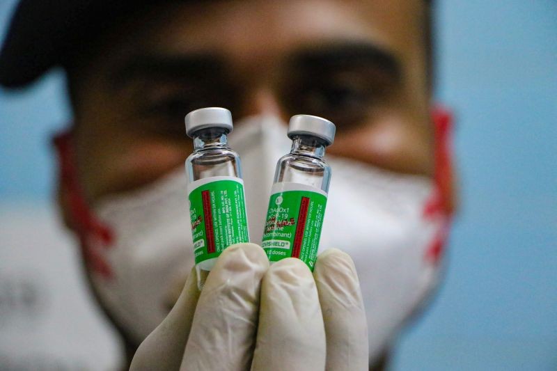 Jammu: A medic show a vial containing doses of Covishield vaccine during a countrywide inoculation drive against the coronavirus, at BSF Hospital in Jammu, Monday, Jan. 25, 2021. (PTI Photo)