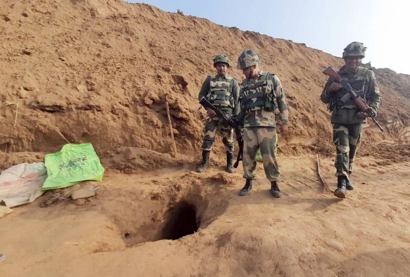 Security officers standing near the mouth of a 150-metre underground tunnel, constructed allegedly by Pakistan beneath International border, at Hiranagar sector of Kathua district on January 13, 2021. (PTI Photo)