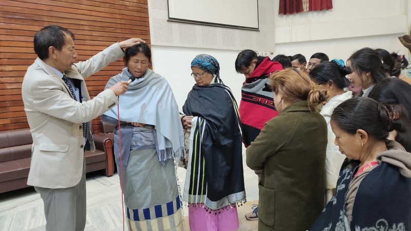 Speaker Rev Zotuo Kiewhuo praying for healing of sick people. (Photo Courtesy: Koinonia Media Ministry)