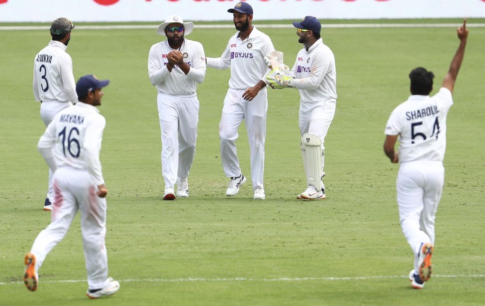 Brisbane : India's Rohit Sharma, second left, reacts as he takes a catch to dismiss Australia's Cameron Green during play on day four of the fourth cricket test between India and Australia at the Gabba, Brisbane, Australia, Monday, Jan. 18, 2021. AP/PTI