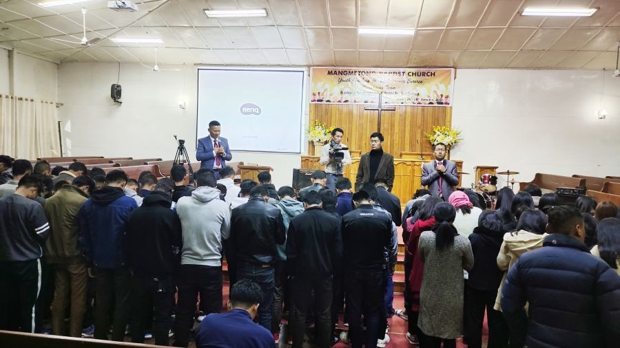 Ministering team Koinonia Baptist Church imparting blessings to the Mangmetong Baptist Church youth programme attendees.