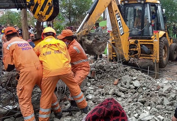 Rescue operation carried out by NDRF personnel after the complex roof of a crematorium collapsed due to heavy rain, at Muradnagar in Ghaziabad, on Sunday. Photograph: PTI Photo