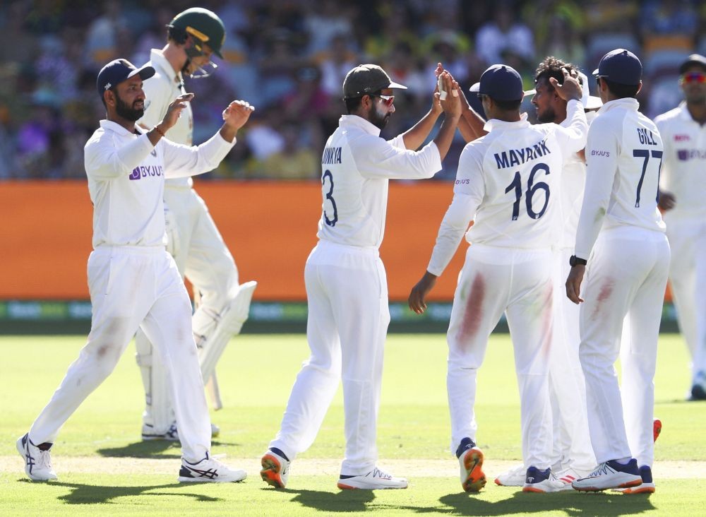 Brisbane: India's Thangarasu Natarajan, second right, is congratulated by teammates after dismissing of Australia's Marnus Labuschagne during play on the first day of the fourth cricket test between India and Australia at the Gabba, Brisbane, Australia, Friday, Jan. 15, 2021. AP/PTI
