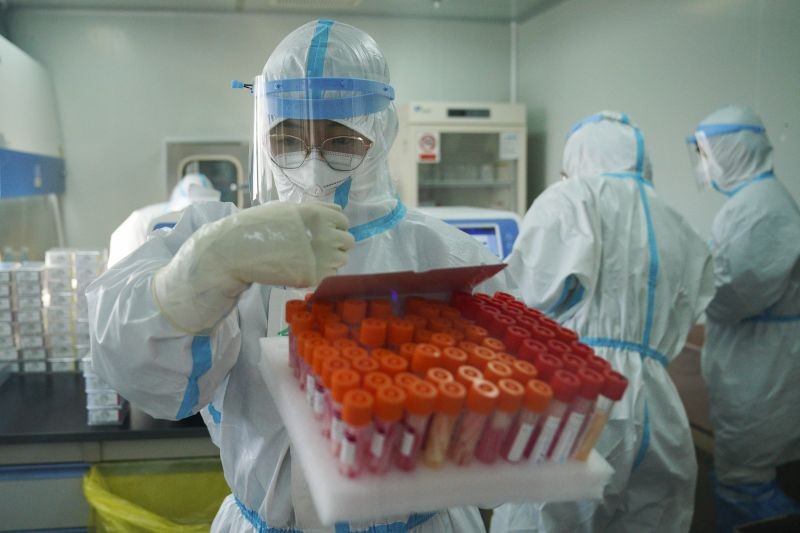 In this photo released by Xinhua News Agency, Yang Hongke checks on test samples at a testing lab of KingMed Diagnostics Group Co., Ltd. in Shijiazhuang in northern China's Hebei Province on January 9, 2021. (AP/PTI File Photo )