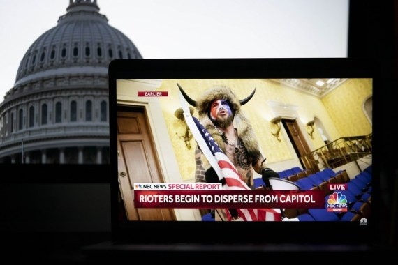 A protester breaking into the U.S. Capitol building is captured on a screenshot in a video feed from NBC news seen in Arlington, Virginia, the United States, Jan. 6, 2021. (Image Source: IANS News)