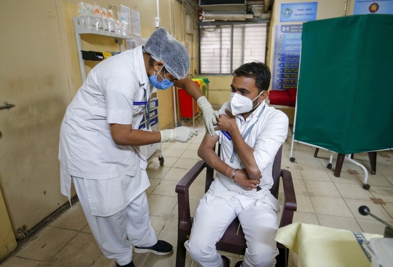 A health worker takes part in a dry run as part of preparedness for the administration of COVID-19 vaccine at Civil Hospital in Ahmedabad, on January 5. (PTI Photo)