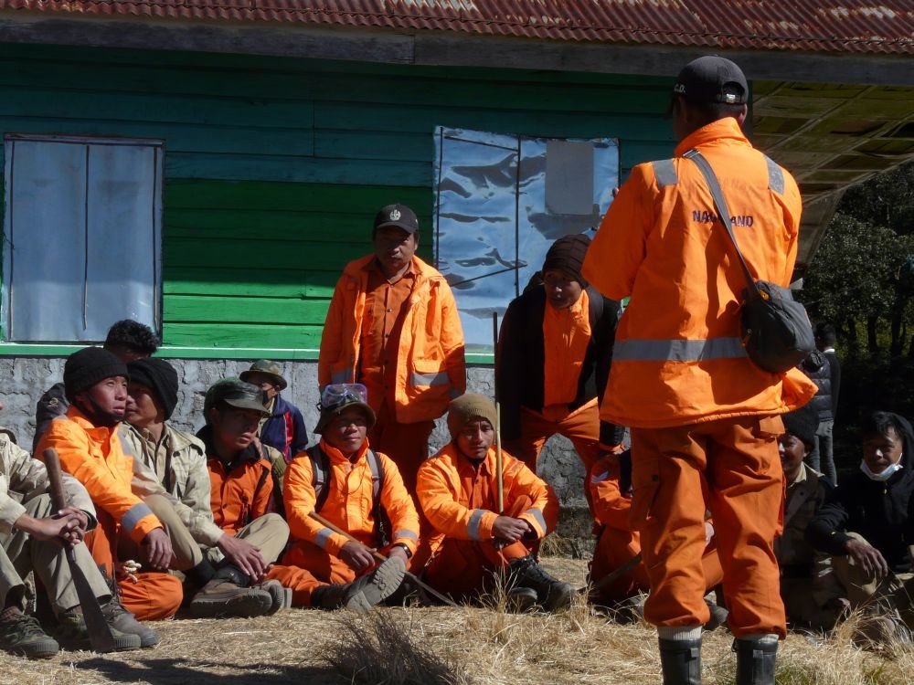 Firefighters and volunteers taking a break from the ongoing operations to douse the fire in Dzükou Valley area on January 7, nine days after it was first reported on December 29. (Photo Courtesy: Adolie Kere)