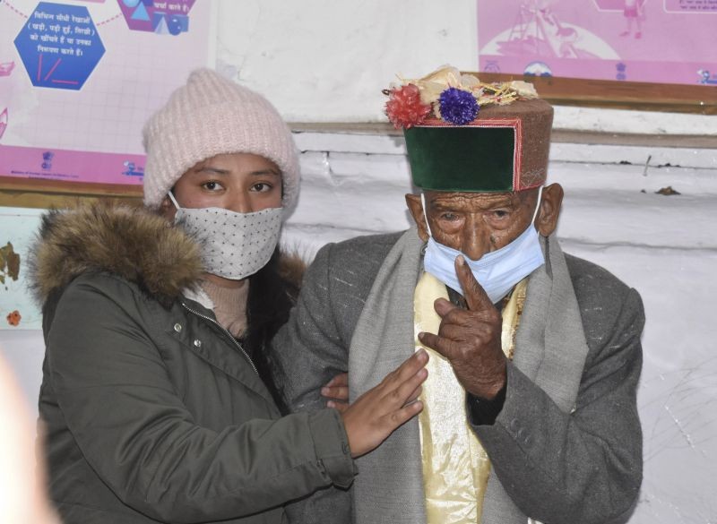 Shyam Saran Negi, believed to be India's oldest voter at 103 years of age, shows his inked finger after casting vote for Panchayat elections, at Kalpa in Kinnaur on January 17, 2021. (PTI Photo)