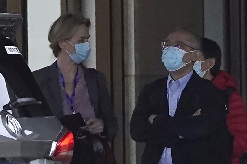 Wuhan: Members of the World Health Organization team including Ken Maeda, right, prepare to leave for a second day of field visit in Wuhan in central China's Hubei province on Saturday, January 30, 2021. (AP/PTI)