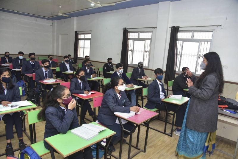 Bikaner: A teacher takes a class after schools reopened for the students of class 9 to 12, following its closure since March 19, 2019 due  to coronavirus pandemic, in Bikaner, Monday, Jan. 18, 2021. (PTI Photo)