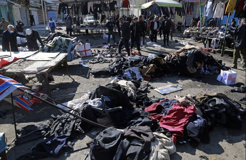 Security forces work at the site of a deadly bomb attack in Baghdad, Iraq ON JanUARY 21, 2021. Iraq's military said twin suicide bombings at the Bab al-Sharqi commercial area in central Baghdad Thursday ripped through the busy market killing over two dozen and wounding over 70, with some in serious condition. (AP/PTI Photo)