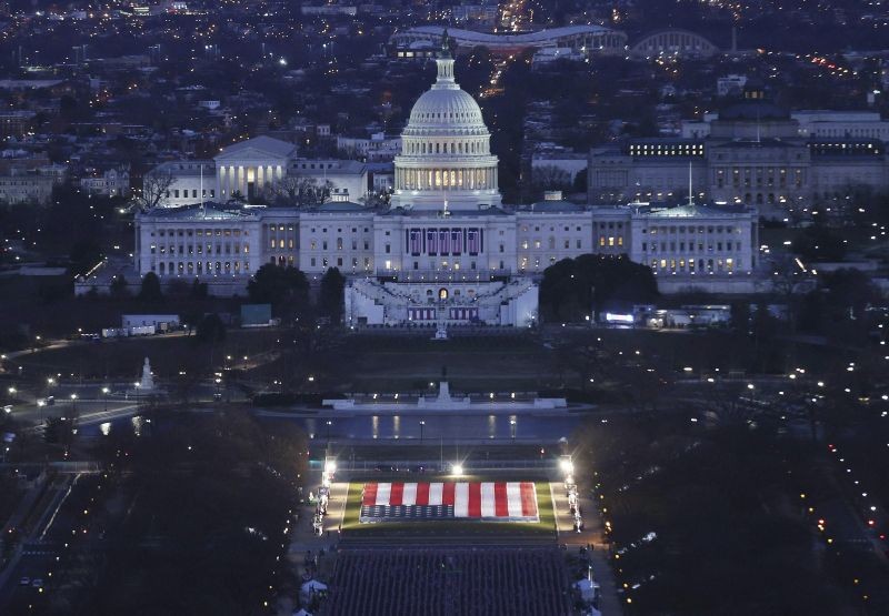 The U.S. Capitol building is prepared for the inauguration ceremonies for President-elect Joe Biden as the "Field of Flags" are placed on the ground on the National Mall on January 18, 2021. in Washington, DC. (AP/PTI Photo)