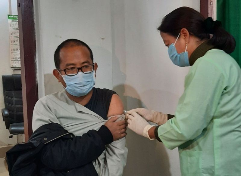 Nurse gives COVID-19 vaccine to Dr H T Sangtam, Senior specialist, IMDH who was the first person to get vaccinated at IMDH, Mokokchung on January 16. (Morung Photo)