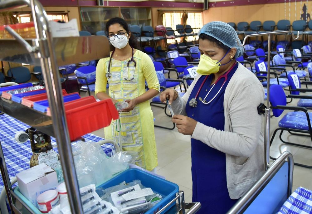 Bengaluru: A health worker prepares for the dry run of COVID-19 vaccine at a civil hospital, in Bengaluru, Friday, Jan. 8, 2021. (PTI Photo/Shailendra Bhojak)