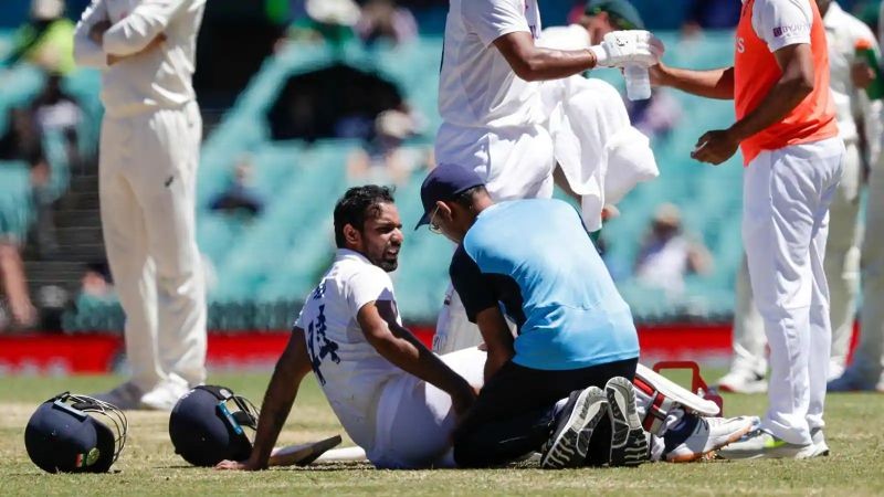 India's Hanuma Vihari receives treatment to a leg injury during play on the final day of the third cricket test between India and Australia at the Sydney Cricket Ground.(AP Photo)