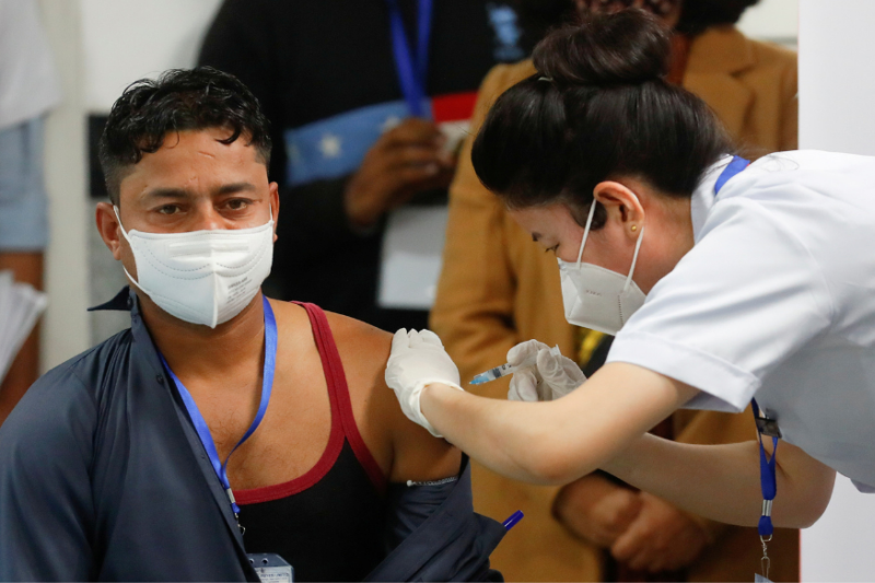 Manish Kumar, a frontline sanitation worker at Delhi AIIMS who received India’s first COVID-19 vaccine in New Delhi on January 16. (PTI Photo)