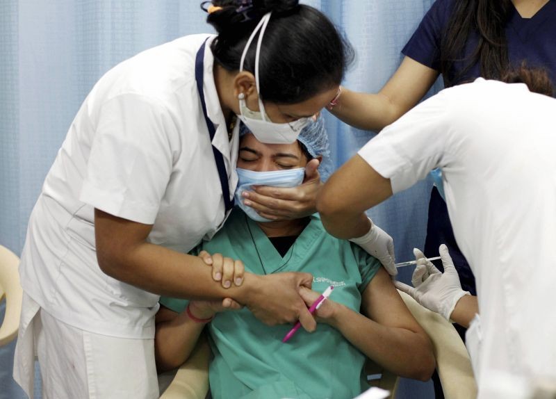 Ahmedabad: A medic administers Covishield vaccine on a beneficiary, at Sola Civil Hospital in Ahmedabad, Tuesday, Feb. 2, 2021. (PTI Photo)