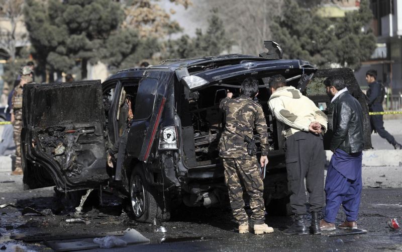Security personnel inspect the site of a deadly bomb attack in Kabul, Afghanistan on February 10. (AP/PTI Photo)