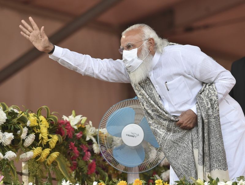 Haldia: Prime Minister Narendra Modi waves at his party activists during a public rally at Haldia Helipad Ground in East Midnapore district, Sunday, Feb 7, 2021. (PTI Photo/Swapan Mahapatra)