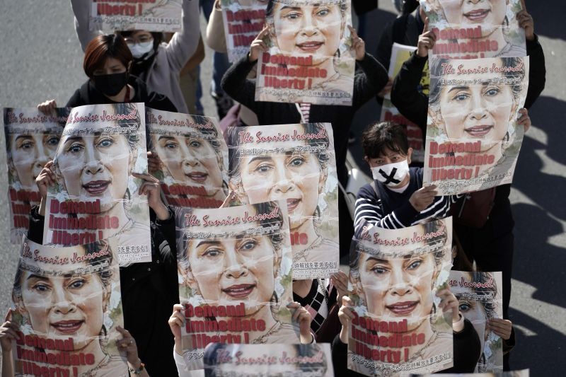 Myanmar people living in Japan and supporters march as they hold posters with an image of deposed Myanmar leader Aung San Suu Kyi during a protest on February 14, 2021, in Tokyo. (AP/PTI Photo)