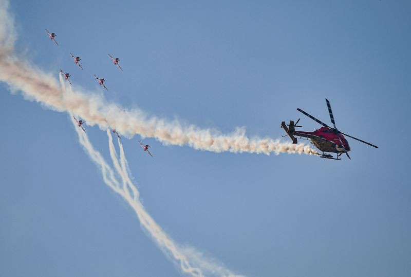 IAF's aerobatic teams Suryakiran and Sarang perform during the valedictory function of the 13th edition of Aero India 2021 at Yelahanka Air Base in Bengaluru on February 5. (PTI Photo)