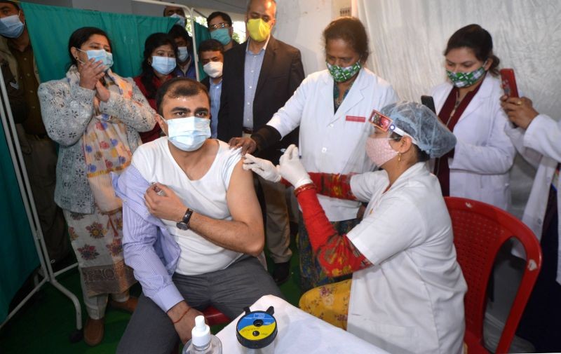 Lucknow: A medic inoculates a dose of COVID-19 vaccine to District Magistrate Abhishek Prakash, in Lucknow, Friday, Feb. 5, 2021. (PTI Photo)