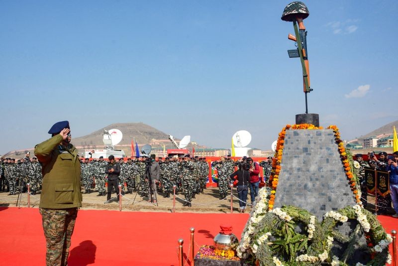 Inspector General of Central Reserve Police Force (CRPF), Deepak Ratan, pays tribute to martyrs of Pulwama attack on its second anniversary, at Lethpora in Pulwama district on February 14. (PTI Photo)