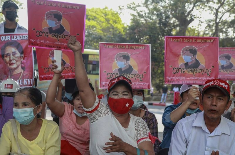 Anti-coup protesters display an image of protester who was shot and killed by Myanmar security forces during a protest two-days earlier as they gather to protest in Yangon, Myanmar on February 23, 2021. (AP/PTI Photo )