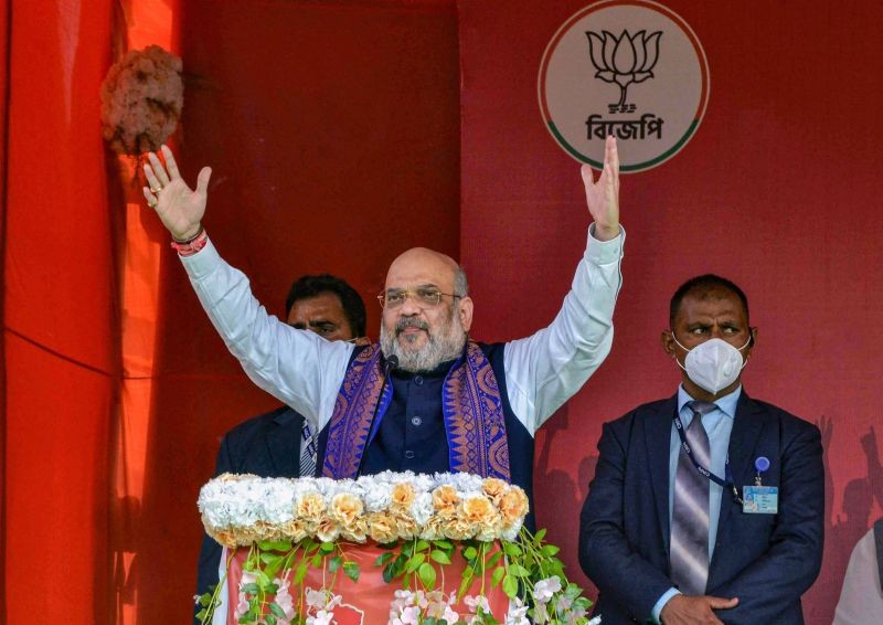 Cooch Behar: Union Home Minister Amit Shah addresses a public rally at Rashmela Mela maidan in Cooch Behar district of West Bengal, Thursday, Feb. 11, 2021. (PTI Photo)