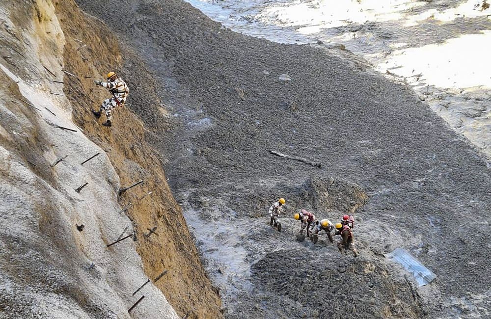 Chamoli: ITBP personnel dig to open Tapovan Tunnel which is completely blocked, after a glacier broke off in Joshimath in Uttarakhand’s Chamoli district causing a massive flood in the Dhauli Ganga river, Sunday, Feb. 7, 2021. More than 150 labourers working at the Rishi Ganga power project may have been directly affected. (PTI Photo)