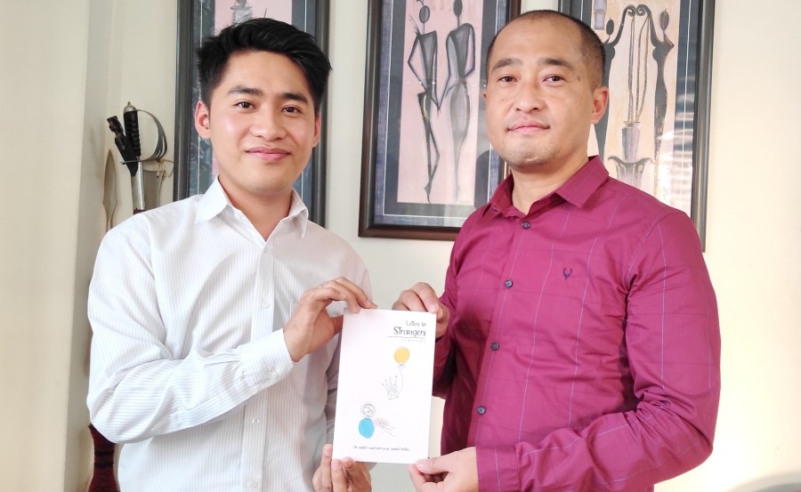 Dr T Jamedi Longkumer (R) releasing the book 'Letters for Strangers' by Sentisuba on February 11.