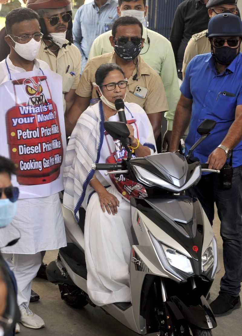 West Bengal Chief Minister Mamata Banerjee addresses media representatives after she arrived at Nabanna (State Secretariat) via an electric scooter during a protest against the hike in fuel price, in Kolkata on February 25, 2021. (PTI Photo)