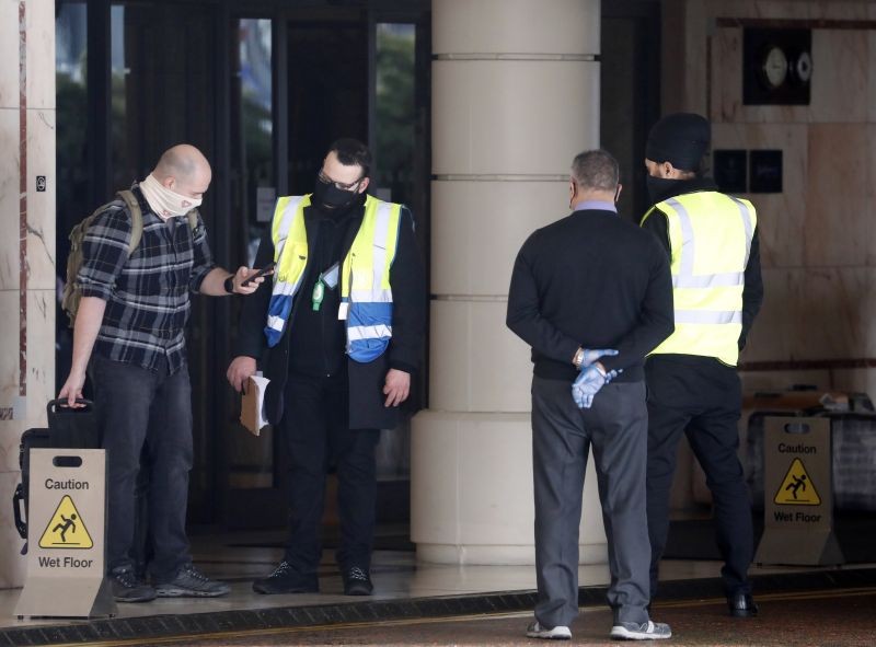 A coach delivers passengers to the Radisson Blu Edwardian Hotel, near Heathrow Airport, London on February 15, 2021 where they will remain during a 10 day quarantine period after returning to England from one of 33 "red list" countries. New regulations now in force require anyone who has been in a 'high-risk' location to enter England through a designated port and have pre-booked a package to stay at one of the Government's managed quarantine facilities. (AP/PTI Photo)