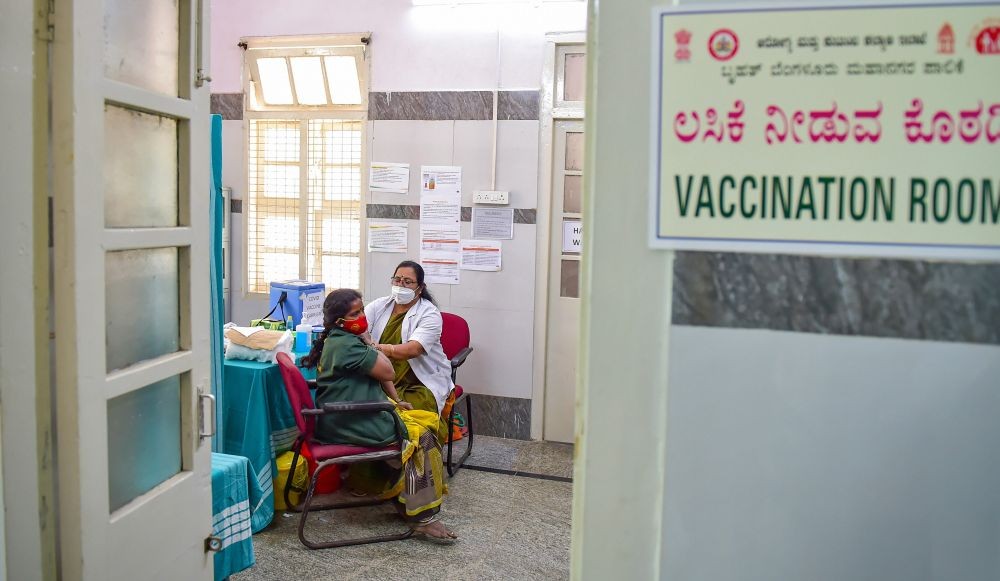 Bengaluru: A medic administers first dose of COVID-19 vaccine to a municipal worker, in Bengaluru, Friday, Feb. 12, 2021. (PTI Photo/Shailendra Bhojak)