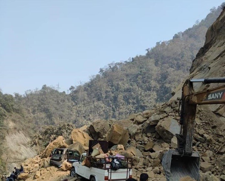 In this photo shared on social media, vehicles are seen stuck in the avalanche of huge rock debris after a rockslide that occurred at New Chümoukedima segment of National Highway 29 on February 2. (Photo Courtesy: Social Media)