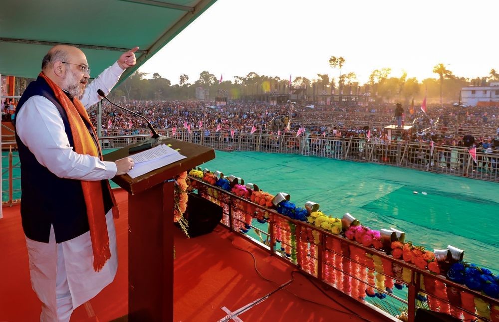 Thakurnagar: Union Home Minister Amit Shah addresses a public meeting at Thakurbari in Thakurnagar, Thursday, Feb. 11, 2021. (PTI Photo)