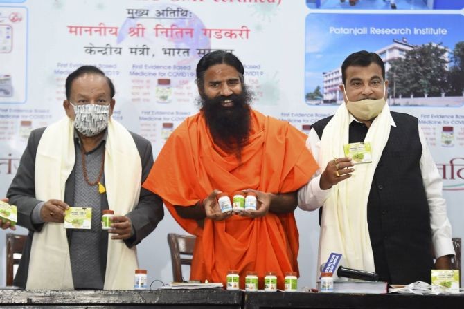 Ramdev releases Patanjali 'medicine for COVID-19', in the presence of Union ministers Nitin Gadkari and Dr Harsh Vardhan, in New Delhi, on Friday. Photograph: Kamal Singh/PTI Photo