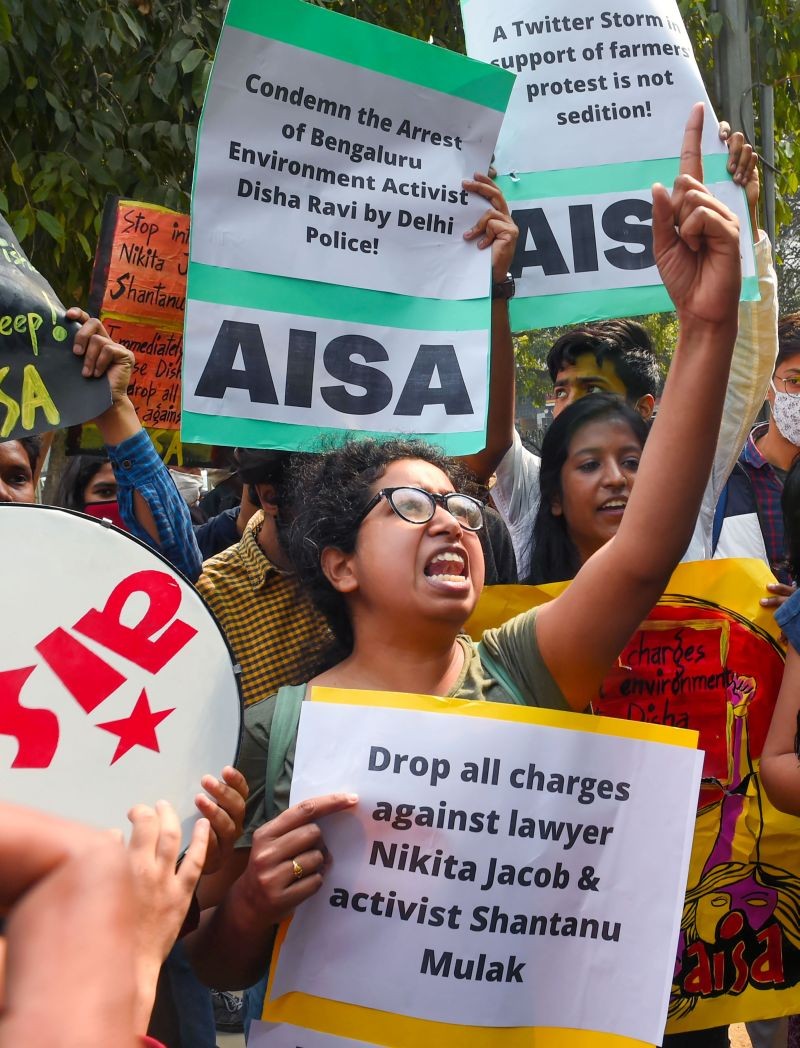 AISA activists display placards and shout slogans during a protest against the arrest of climate activist Disha Ravi, at Police Headquarters in New Delhi on February 16, 2021. Disha A. Ravi was arrested on Saturday by the Delhi Police in connection with the Greta Thunberg's 'toolkit' case. (PTI Photo)