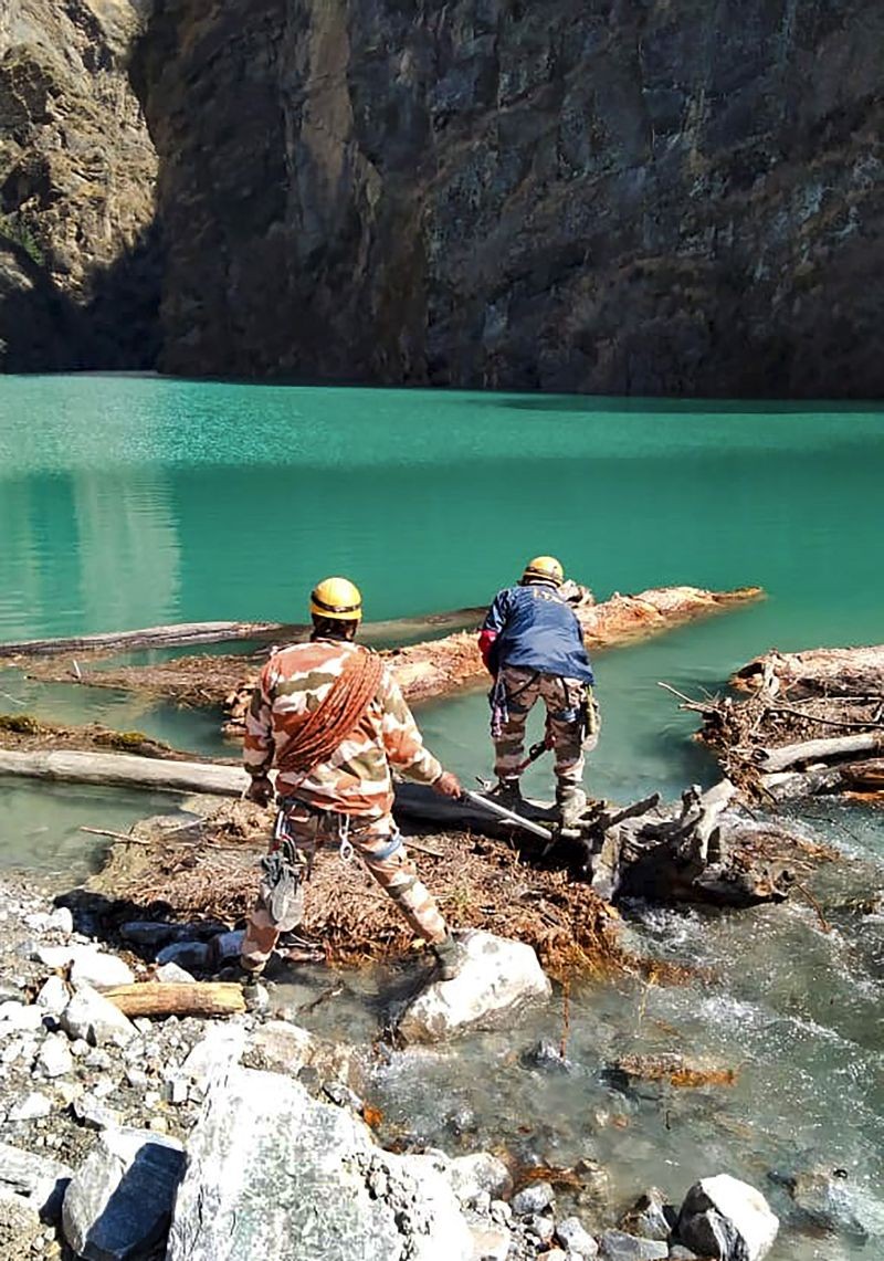 An Indo-Tibetan Border Police team with officials from the Defence Research and Development Organisation (DRDO) reached Murenda, where a natural lake has been formed after the recent floods, in Chamoli in Uttarakhand on February 17, 2021. (PTI Photo)