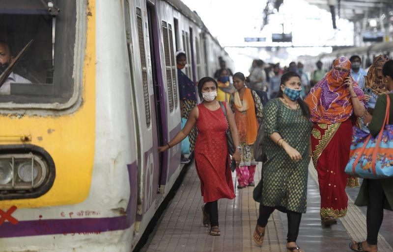 Mumbai: Commuters deboard a train as suburban train services resumed for the public after a gap of nearly ten months due to the coronavirus pandemic, in Mumbai, Monday, Feb. 01, 2021. SecondaryInfo. (PTI Photo/Kunal Patil)