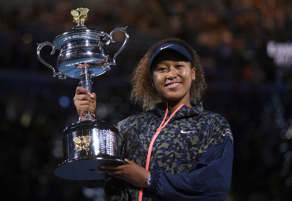 Melbourne:  Japan's Naomi Osaka holds the Daphne Akhurst Memorial Cup aloft after defeating United States Jennifer Brady in the women's singles final at the Australian Open tennis championship in Melbourne, Australia, Saturday, Feb. 20, 2021.AP/PTI