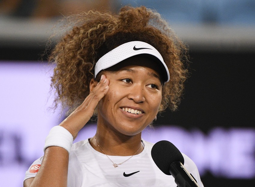 Japan's Naomi Osaka is interviewed after defeating Romania's Irina-Camelia Begu at a tuneup event ahead of the Australian Open tennis championships in Melbourne, Australia, Friday, Feb. 5, 2021.(AP Photo/Andy Brownbill)