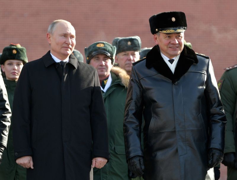 Russian President Vladimir Putin, left, and Russian Defense Minister Sergei Shoigu attend a wreath-laying ceremony at the Tomb of the Unknown Soldier, near the Kremlin during the national celebrations of the 'Defender of the Fatherland Day' in Moscow, Russia on February 23, 2021. (AP/PTI Photo)