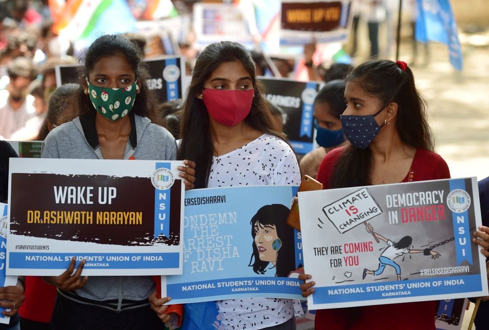Bengaluru: Students and members of NSUI display placards during a protest to condemn the arrest of climate activist Disha Ravi and against the state government demanding the two days holiday before every exam, in Bengaluru, Tuesday, Feb. 16, 2021. (PTI Photo/Shailendra Bhojak