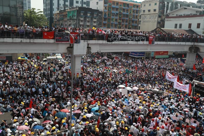 Anti-coup protesters gather at an intersection in downtown Yangon, Myanmar on February 22, 2021. Protesters gathered in Myanmar's biggest city Monday despite the ruling junta's thinly veiled threat to use lethal force if people answered a call for a general strike opposing the military takeover three weeks ago. (AP/PTI Photo)