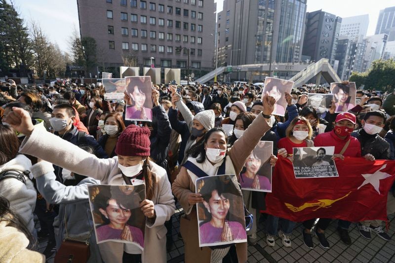 People holding portraits of Myanmar's de facto government leader Aung San Suu Kyi stage a protest rally in front of the United Nations University in Tokyo Monday, Feb. 1, 2021, after Myanmar's military was taking control of the country for one year. AP/PTI