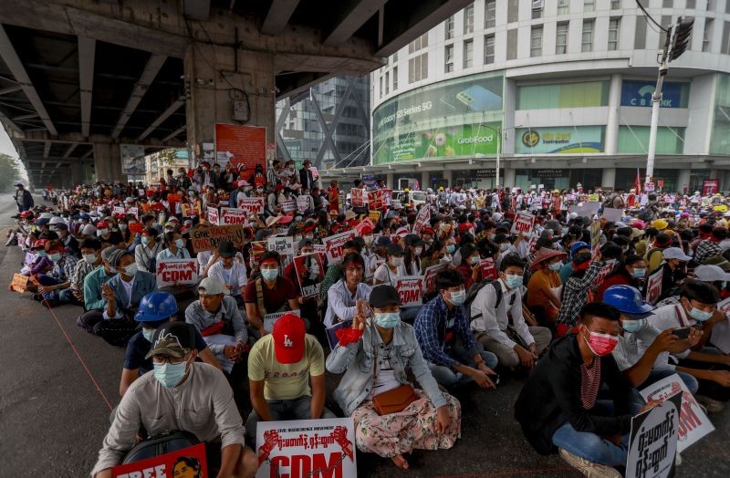 Demonstrators display pictures of deposed Myanmar leader Aung San Suu Kyi during a protest against the military coup in Yangon, Myanmar on February 18, 2021. Demonstrators against Myanmar's military takeover returned to the streets Thursday after a night of armed intimidation by security forces in the country's second biggest city. (AP/PTI Photo)